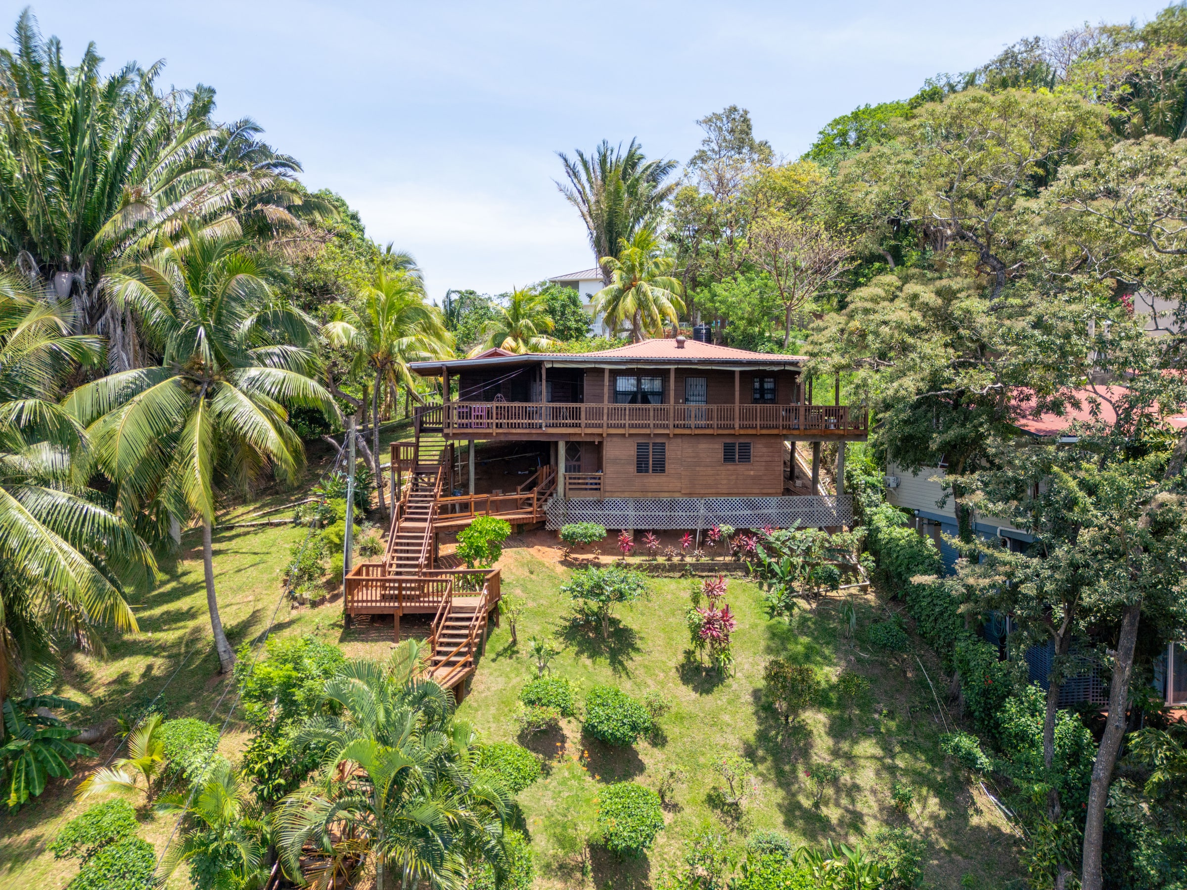 Gibson Bight home surrounded by tropical gardens
